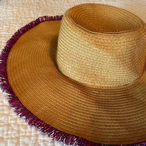 Sun hat with pink and purple tassels